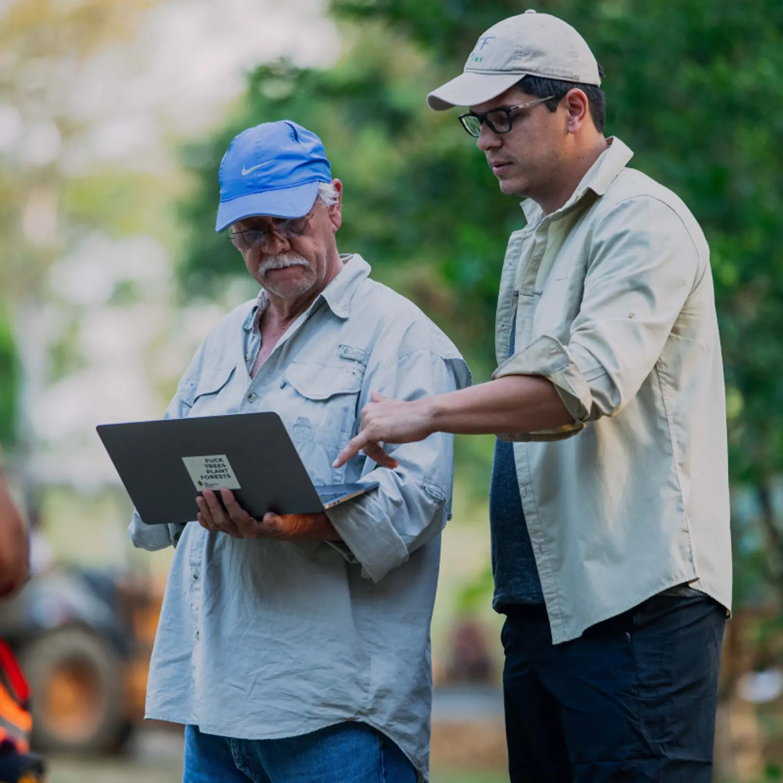Workers planting native trees